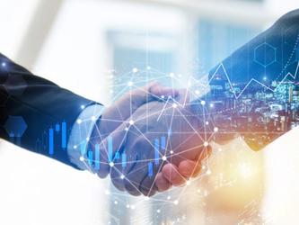 Two men shaking hands, with data concept